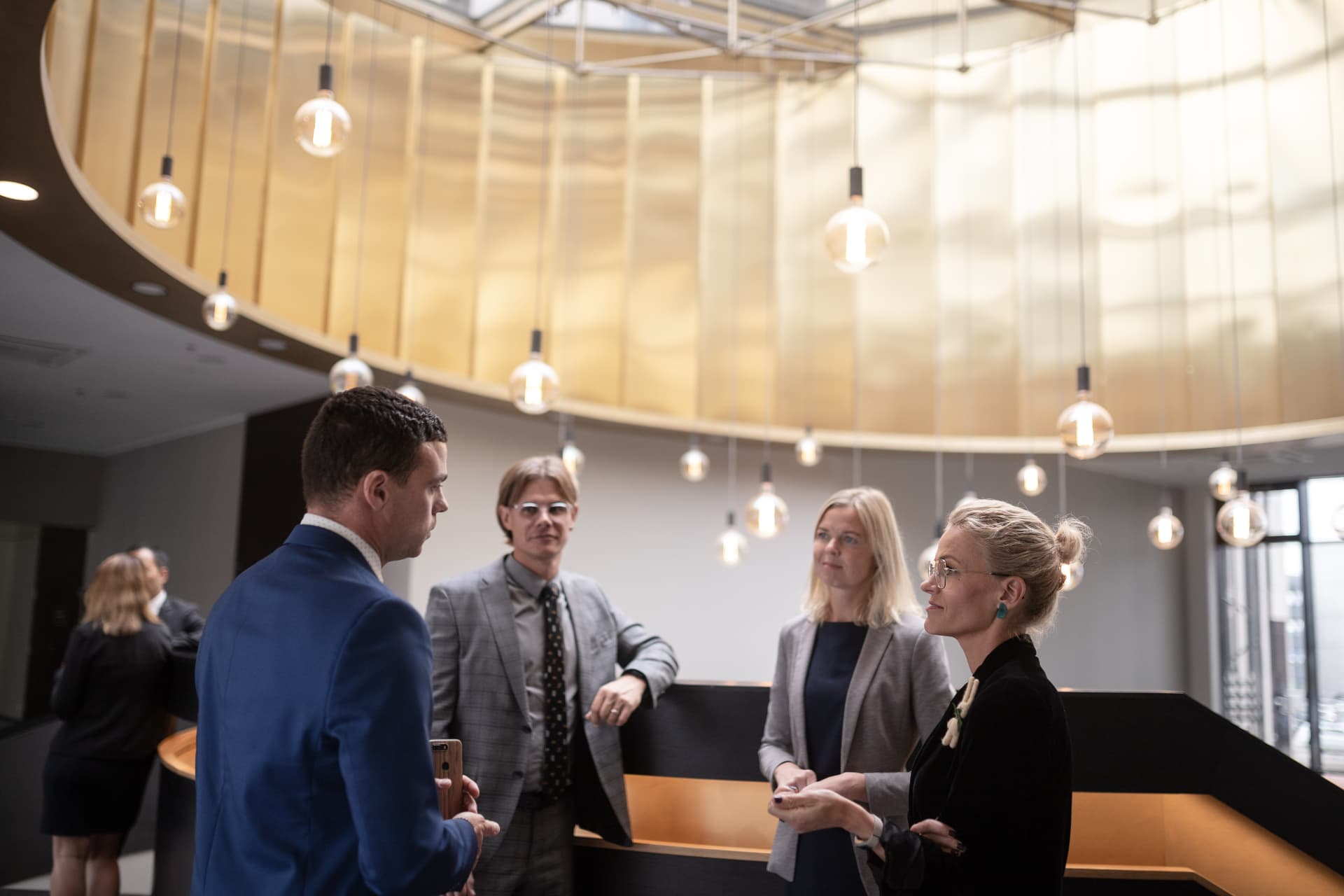 Business leaders in conversation at a summit venue
